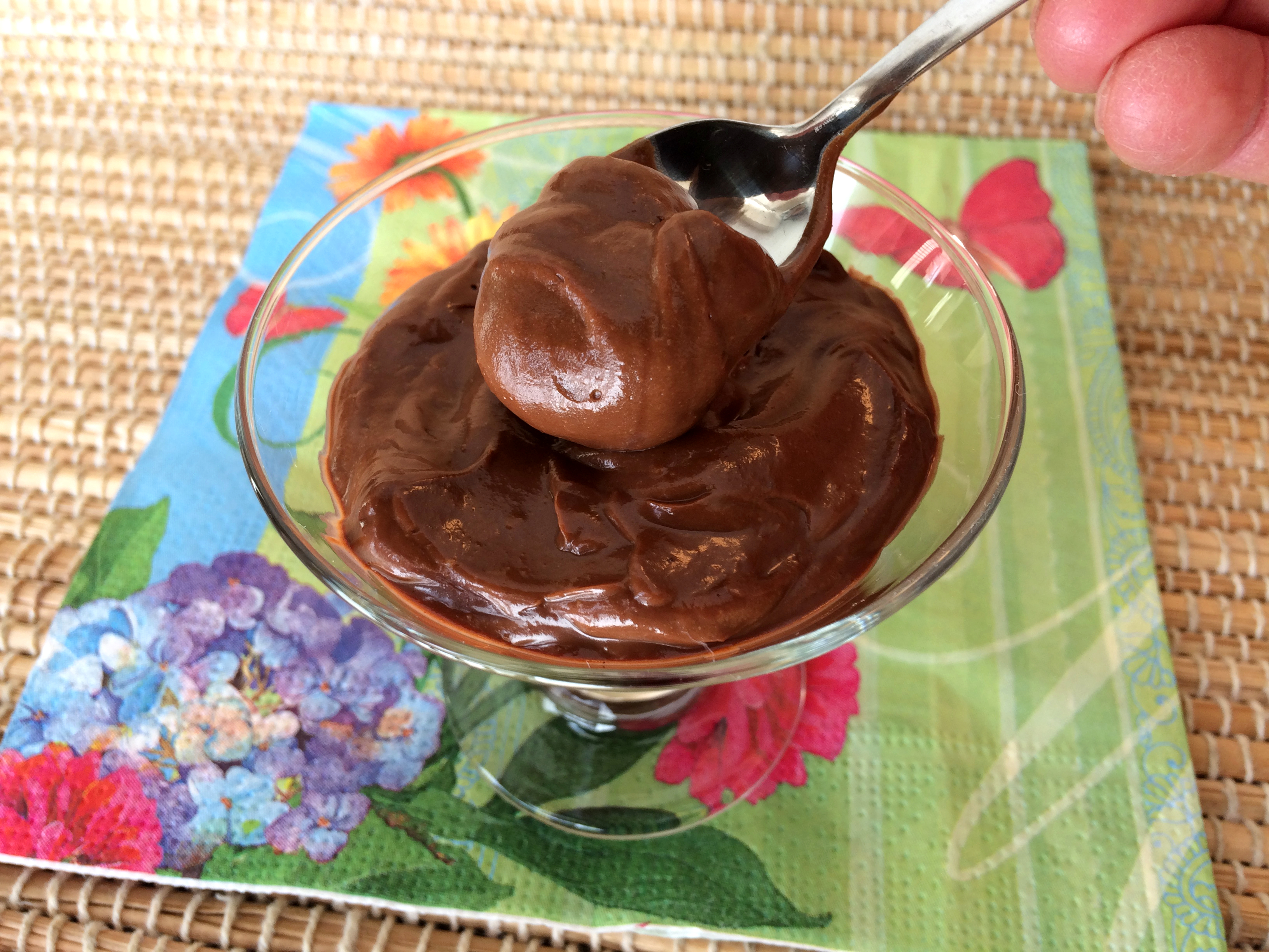 Spooning up some creamy, rich chocolate pudding without sugar, gluten, eggs or dairy